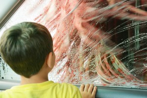 Scared boy at car wash