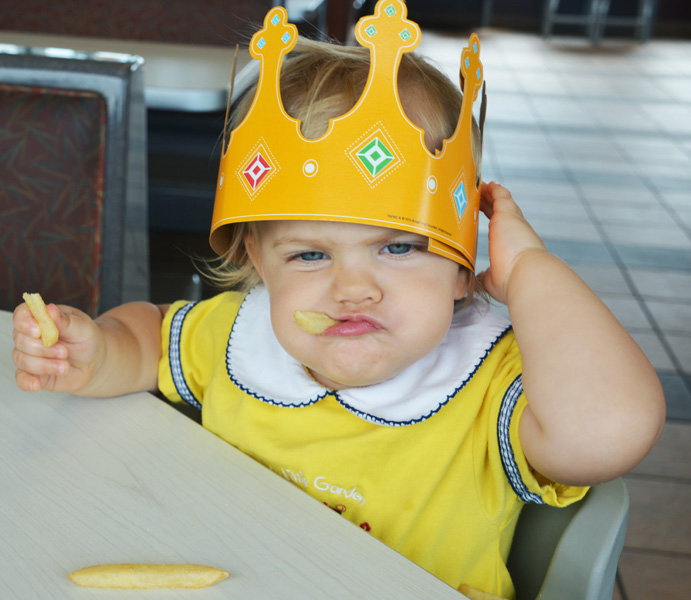 Baby eating french fries