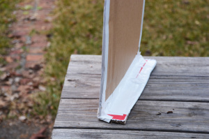 Cardboard box playhouse - attach bottom piece to chimney