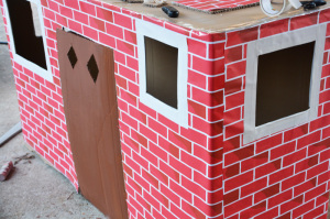Cardboard box playhouse - cut and trim remaining windows