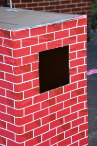 Cardboard box playhouse - cut first window