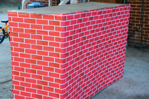 Cardboard box playhouse - wrap with brick paper