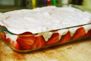 Cream poured over strawberries