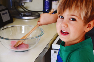 Child helps mom cook