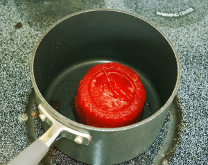 Place frozen strawberries in saucepan