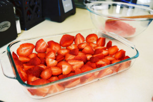 Strawberries arranged in bottom of pan